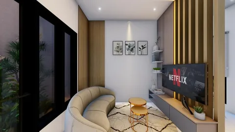 Ruang keluarga rumah Bumi Citra Regency Serpong dengan sofa dan televisi dinding